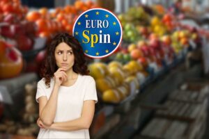 bancone di frutta, logo eurospin e donna che pensa